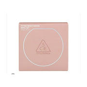 3CE三熹玉水雾粉气垫外包装盒，粉色方形纸盒，印有FITTING MESH CUSHION REFILL SET字样及品牌标志性三角形LOGO。