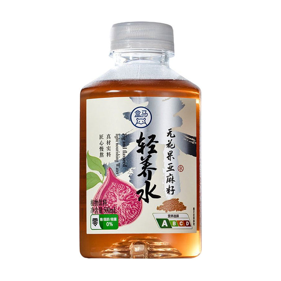 盒马轻养水无花果亚麻籽口味500ml瓶装正面图，白色标签印有无花果图案，标注0糖0脂0能量。