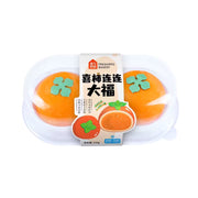 盒马喜柿连连大福正面图，两颗柿子造型的冷冻甜点，外皮软糯点缀绿叶