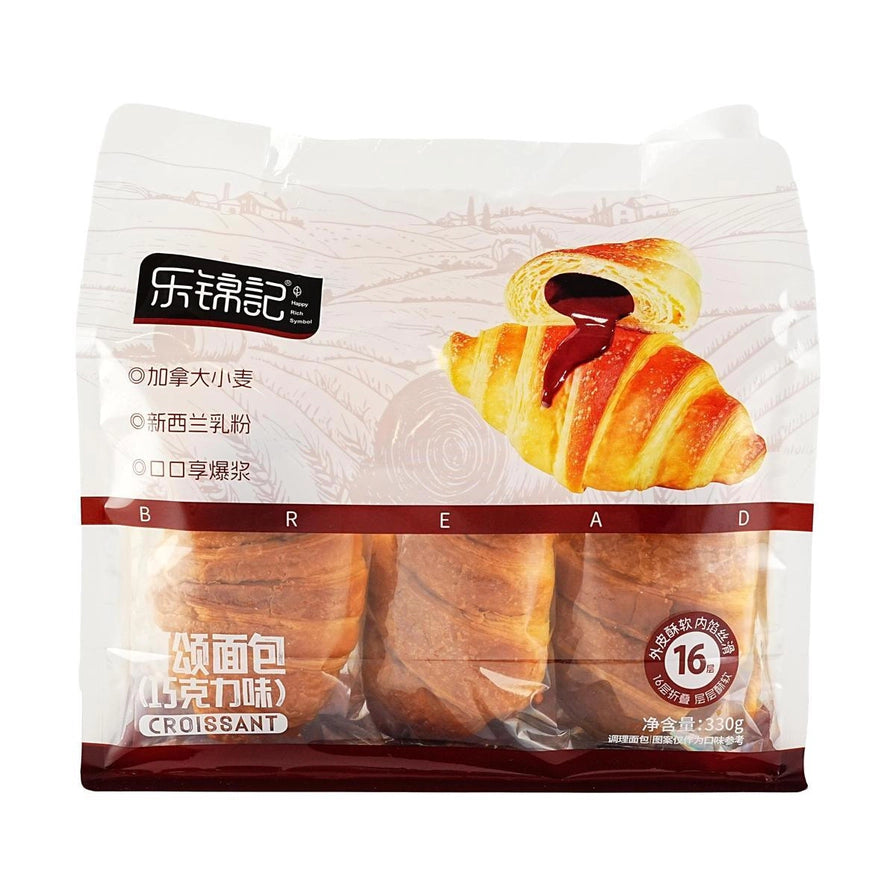 乐锦记巧克力味可颂面包包装，展示了流心巧克力内馅的牛角包切面图，下方为独立包装实物。