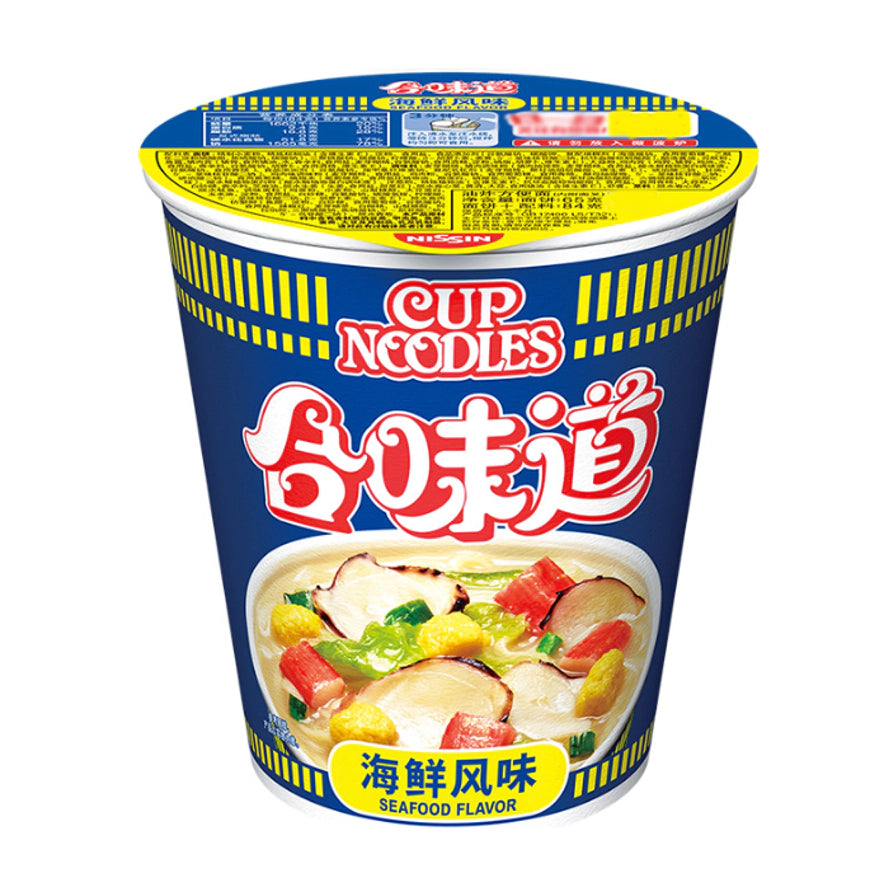 日清合味道开杯乐海鲜风味杯面，蓝色杯身印有Cup Noodles和合味道标志，下方展示包含蟹柳、蛋粒和蔬菜的鲜美汤底。