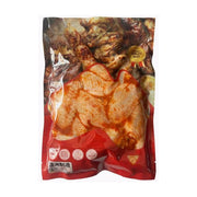 奥尔良鸡翅中1kg透明真空包装袋，可见内部腌制好的鸡翅，包装底部带有澳洲制造标识及烹饪图标。