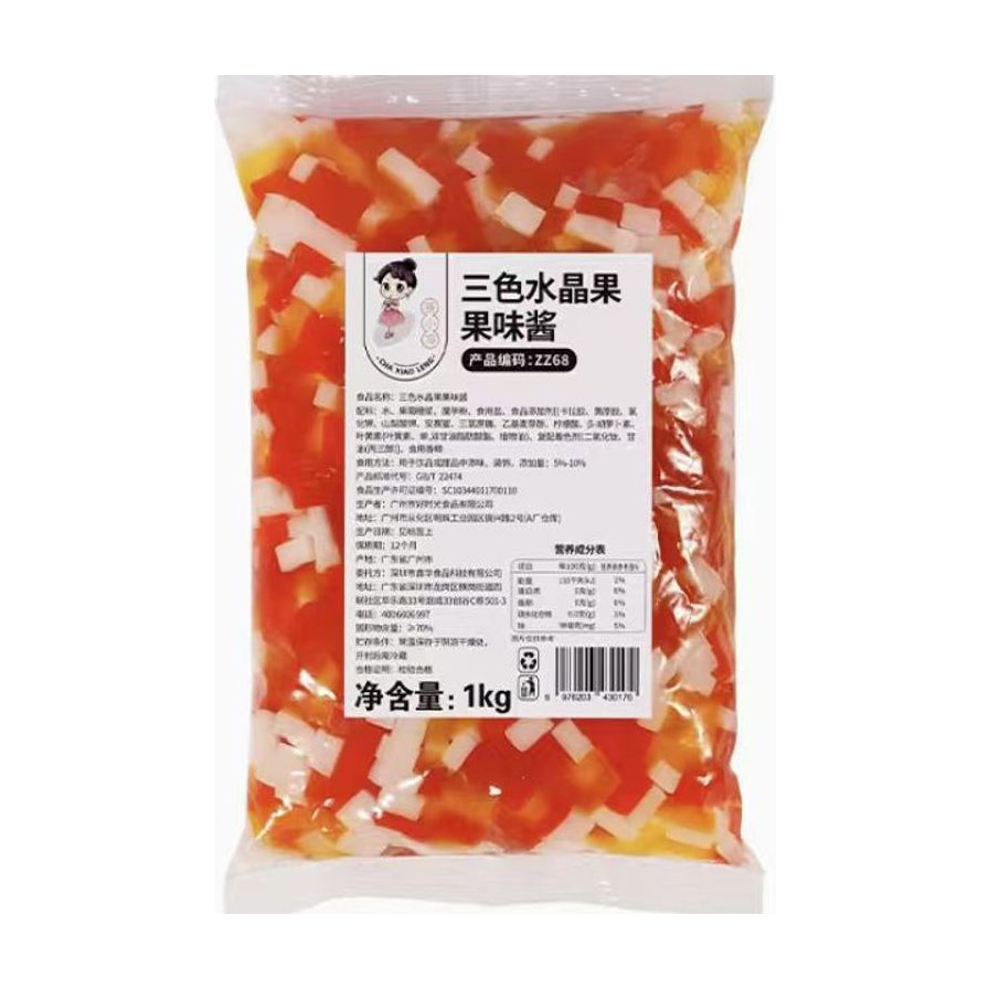 三色水晶果果味酱1kg袋装，透明包装可见红、黄、白三色Q弹颗粒，包装正面印有详细产品信息及营养成分表。
