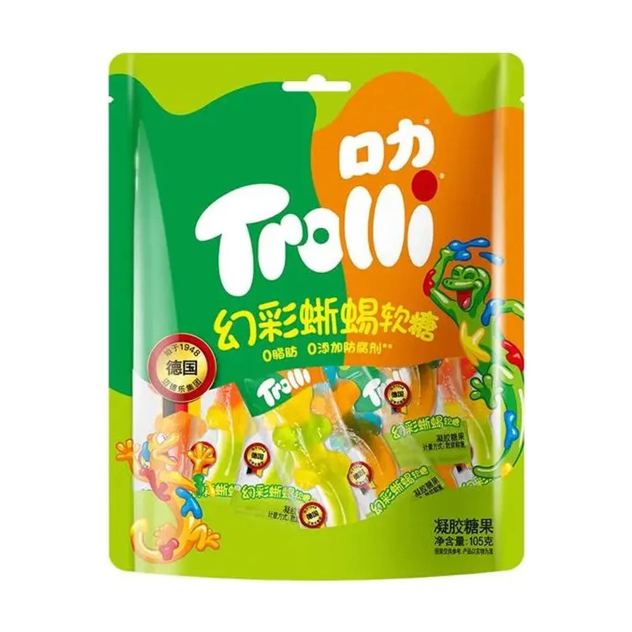 口力 Trolli 幻彩蜥蜴软糖 105g 包装袋正面，绿色与橙色背景，印有品牌 Logo、产品名称及彩色蜥蜴造型图案。