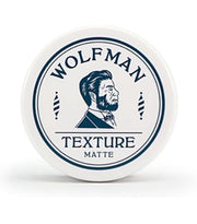 Wolfman Texture Matte 男士哑光发泥白色圆形铁盒包装正面俯视图，盖面印有品牌 Logo 及胡须男士插画。
