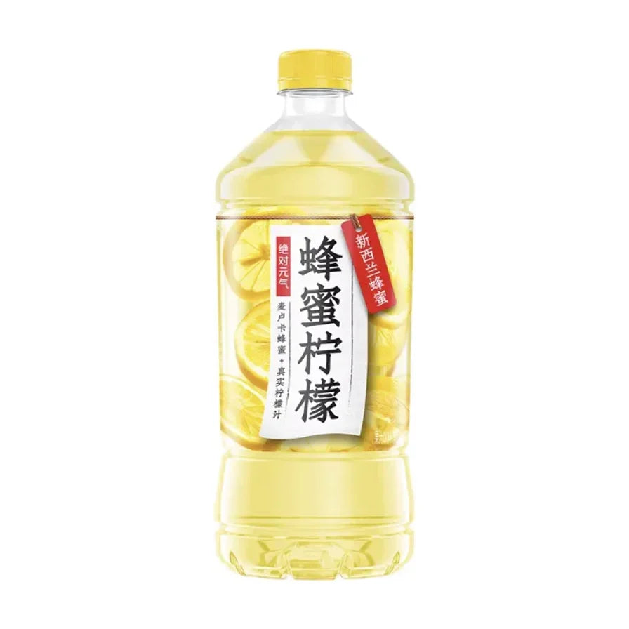 元气森林蜂蜜柠檬水900ml大容量瓶装，包装上有新鲜柠檬切片图案和新西兰蜂蜜标识。