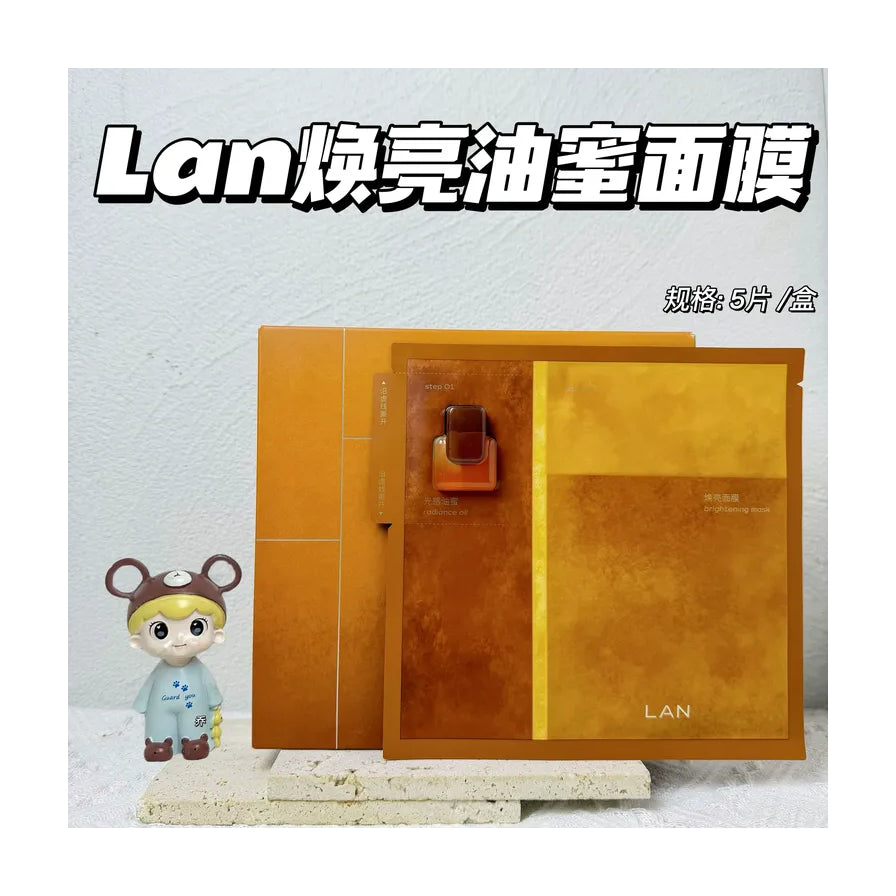 兰面膜外盒与单片包装展示图，左侧摆放卡通玩偶，图片顶部有“Lan 焕亮油蜜面膜”大字标题。